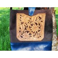 Hand Carved & finished outside pocket hand sewn onto the front of the bag.